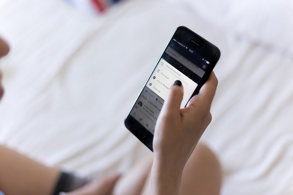 Hand holding mobile phone 