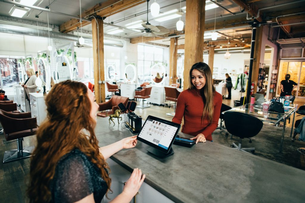Women checking out in retail store